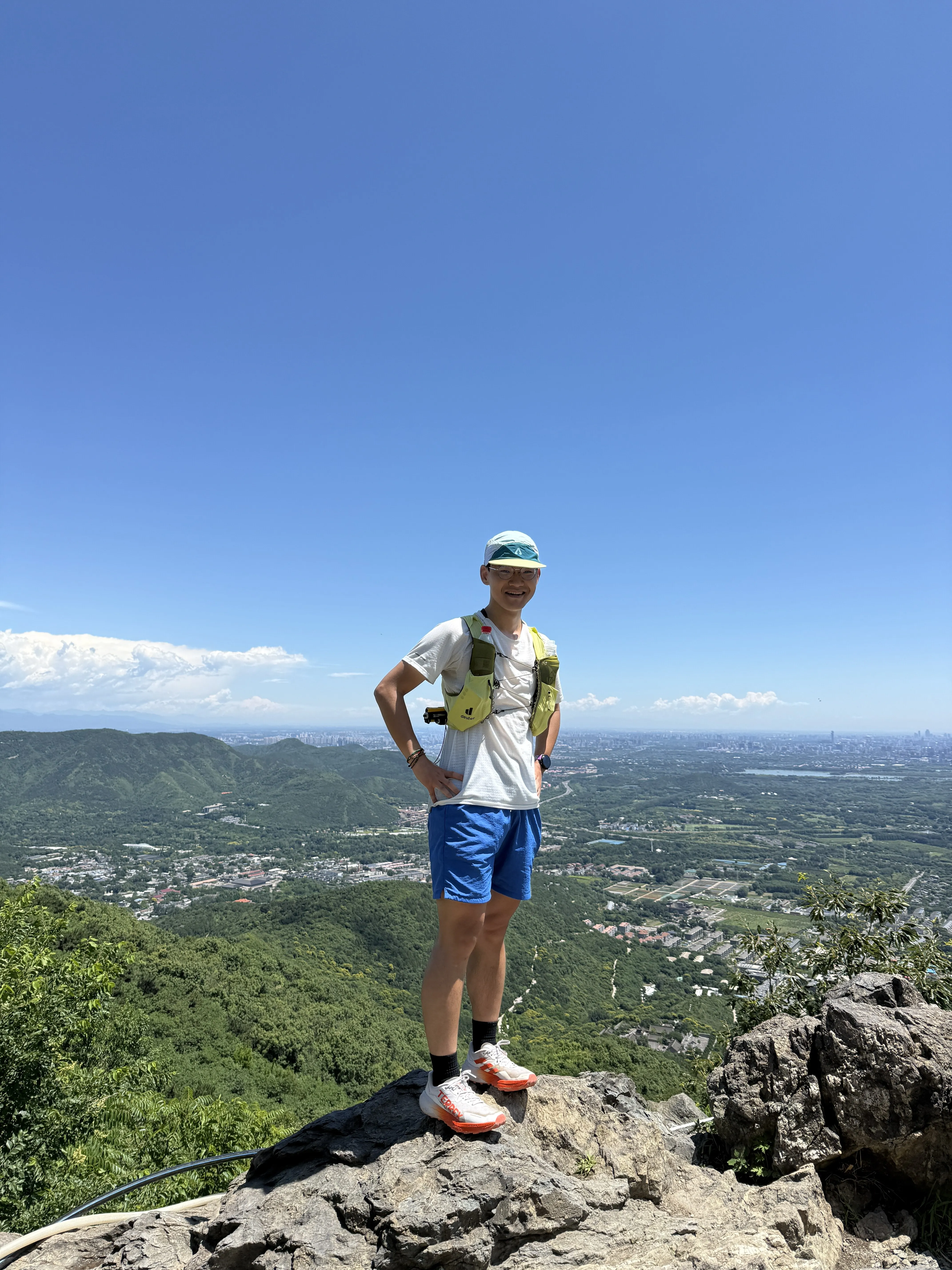 Forrest standing on a mountain trail.